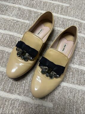Miu Miu Nude Patent Leather Loafers with Black Bow and Crystal Accents